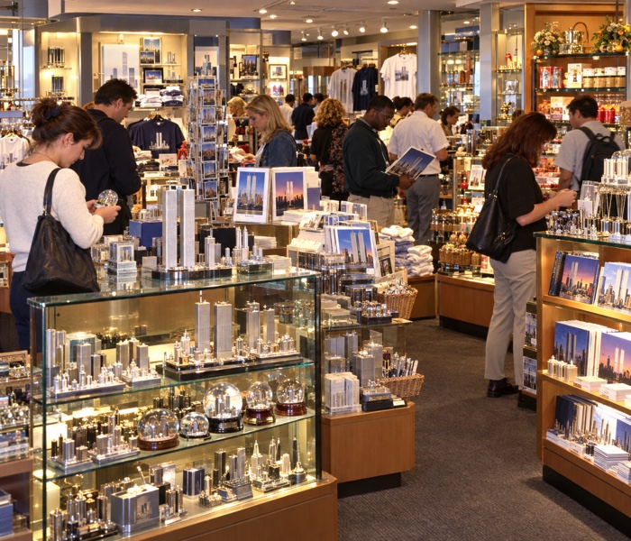 Reconstruction of tourists shopping for New York souvenirs in a Top of the World gift shop around 2001